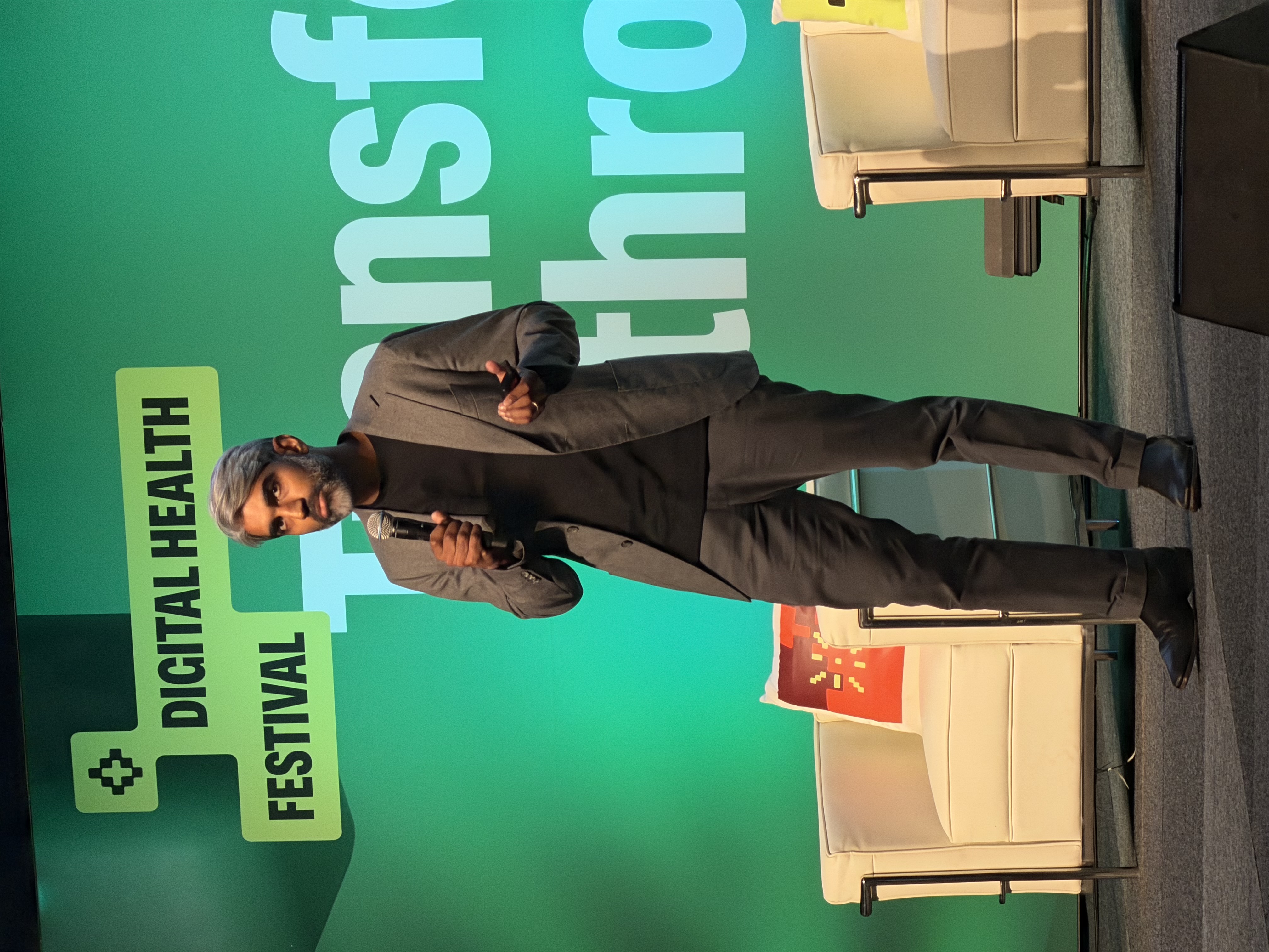 Dr Ray Boyapati presenting on stage at Digital Health Festival 2026